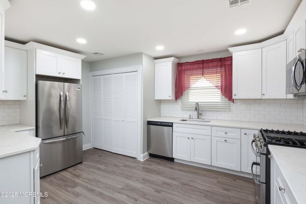 Interior, Kitchen, Recessed Lighting, Stainless Steel Appliances, Wood Texture Flooring