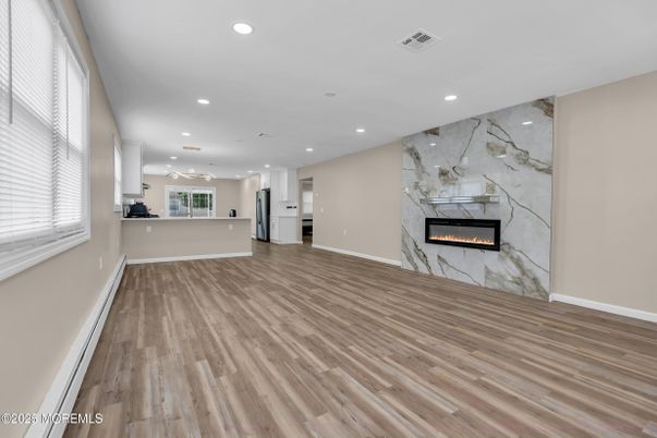Empty room, Fireplace, Interior, Marble Walls, Recessed Lighting, Wood Texture Flooring
