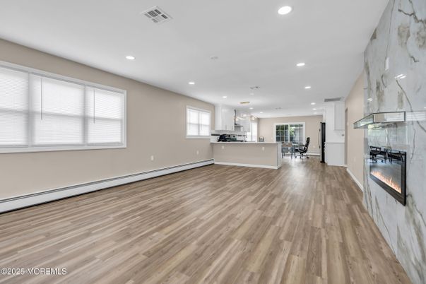 Dining room, Fireplace, Interior, Kitchen, Marble Walls, Pendant Lights, Recessed Lighting, Wood Texture Flooring