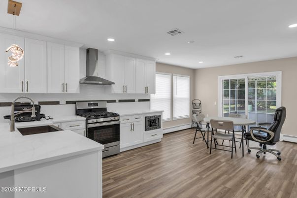 Dining room, Interior, Kitchen, Recessed Lighting, Stainless Steel Appliances, Wood Texture Flooring