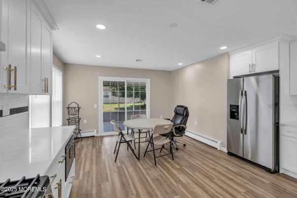 Dining room, Interior, Kitchen, Recessed Lighting, Stainless Steel Appliances, Wood Texture Flooring