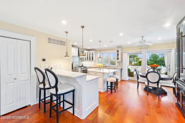 Dining room, Interior, Kitchen, Pendant Lights, Recessed Lighting, Stainless Steel Appliances, Wood Texture Flooring