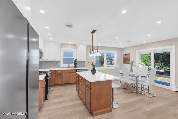 Dining room, Interior, Kitchen, Pendant Lights, Recessed Lighting, Stainless Steel Appliances, Wood Texture Flooring