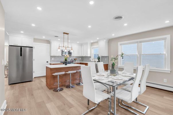 Dining room, Interior, Kitchen, Pendant Lights, Recessed Lighting, Stainless Steel Appliances, Wood Texture Flooring
