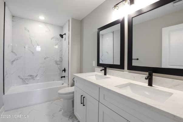 Bathroom, Dual Sink Vanities, Interior, Marble, Marble Walls, Recessed Lighting