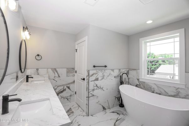 Bathroom, Dual Sink Vanities, Free Standing Baths, Interior, Marble, Marble Walls, Recessed Lighting