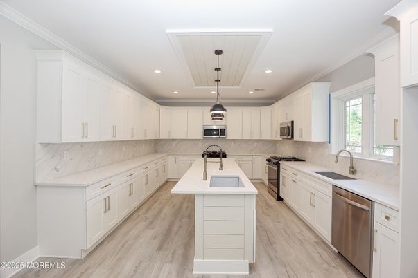 Interior, Kitchen, Marble Walls, Pendant Lights, Recessed Lighting, Stainless Steel Appliances, Wood Texture Flooring