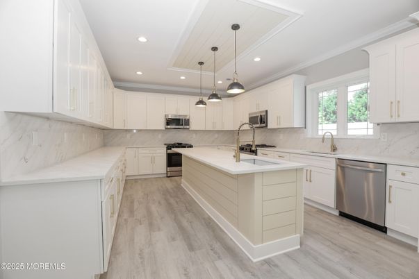 Interior, Kitchen, Marble Walls, Pendant Lights, Recessed Lighting, Stainless Steel Appliances, Wood Texture Flooring