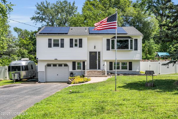 Attached, Exterior, Facade, Solar Panels, Raised Ranch