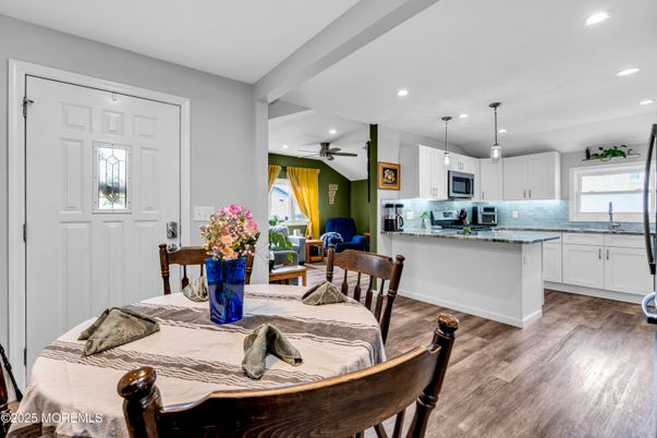 Dining room, Interior, Kitchen, Pendant Lights, Recessed Lighting, Stainless Steel Appliances, Wood Texture Flooring