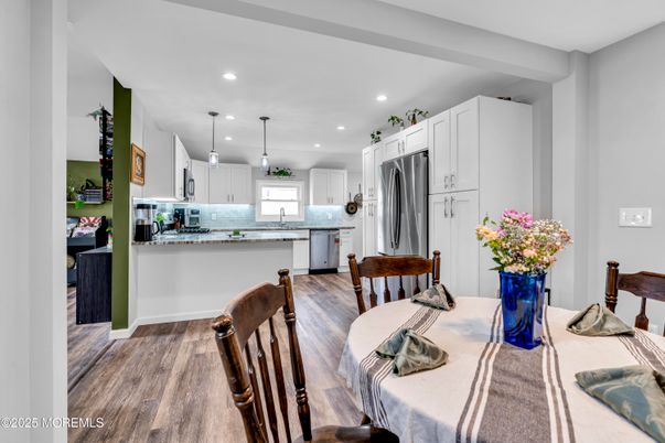 Dining room, Interior, Kitchen, Pendant Lights, Recessed Lighting, Stainless Steel Appliances, Wood Texture Flooring