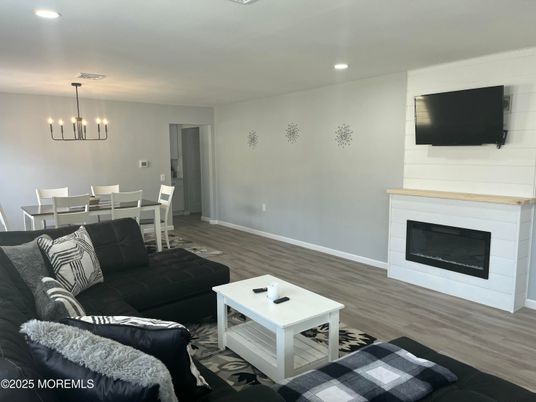 Dining room, Fireplace, Interior, Living room, Pendant Lights, Recessed Lighting, Wood Texture Flooring