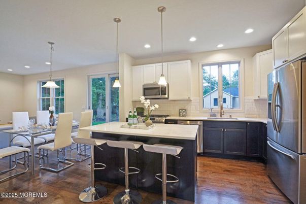 Dining room, Interior, Kitchen, Pendant Lights, Recessed Lighting, Stainless Steel Appliances, Wood Texture Flooring