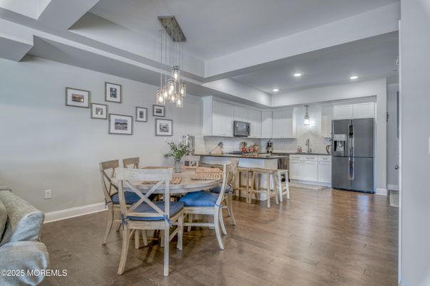 Dining room, Interior, Kitchen, Pendant Lights, Recessed Lighting, Stainless Steel Appliances, Wood Texture Flooring