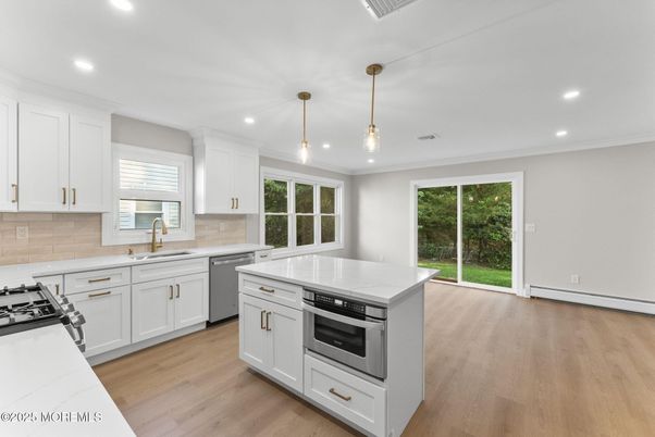 Interior, Kitchen, Pendant Lights, Recessed Lighting, Stainless Steel Appliances, Wood Texture Flooring
