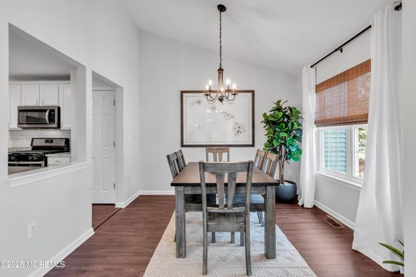 Chandelier, Dining room, Interior, Kitchen, Pendant Lights, Stainless Steel Appliances, Wood Texture Flooring