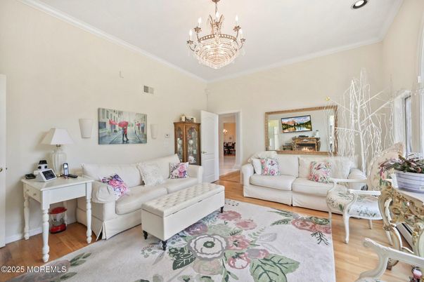 Chandelier, Fireplace, Interior, Living room, Recessed Lighting, Wood Texture Flooring