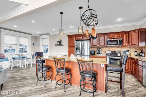 Dining room, Interior, Kitchen, Pendant Lights, Recessed Lighting, Stainless Steel Appliances, Wood Texture Flooring