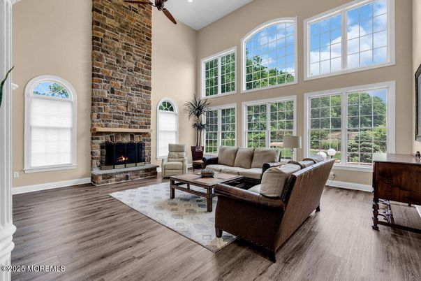 Fireplace, Interior, Living room, Recessed Lighting, Stone Walls, Wood Texture Flooring