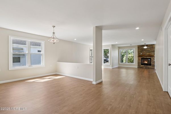 Empty room, Fireplace, Interior, Pendant Lights, Recessed Lighting, Wood Texture Flooring