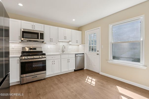 Interior, Kitchen, Recessed Lighting, Stainless Steel Appliances, Wood Texture Flooring