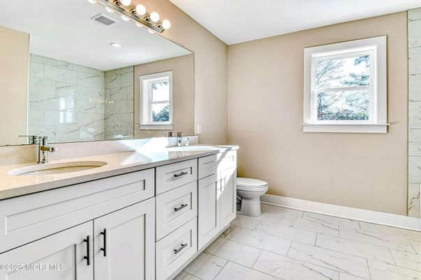 Bathroom, Dual Sink Vanities, Interior, Marble, Marble Walls, Recessed Lighting