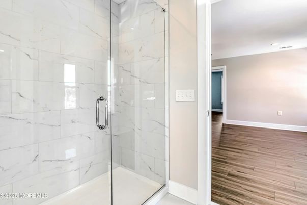 Bathroom, Glass Shower, Interior, Marble Walls, Recessed Lighting, Wood Texture Flooring