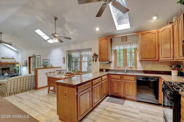 Dining room, Fireplace, Interior, Kitchen, Recessed Lighting, Wood Texture Flooring