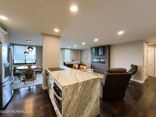 Dining room, Interior, Kitchen, Pendant Lights, Recessed Lighting, Stainless Steel Appliances, Wood Texture Flooring