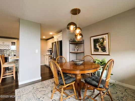Dining room, Interior, Kitchen, Pendant Lights, Recessed Lighting, Stainless Steel Appliances, Wood Texture Flooring