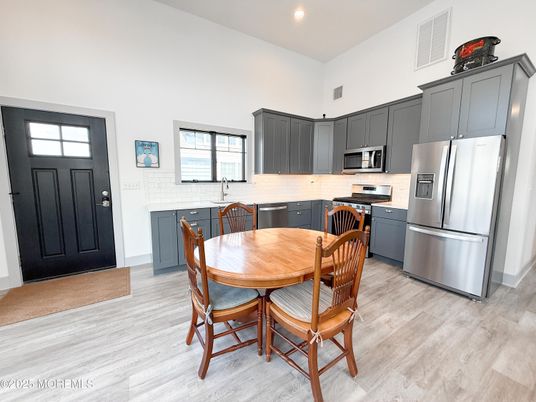 Dining room, Interior, Kitchen, Recessed Lighting, Stainless Steel Appliances, Wood Texture Flooring