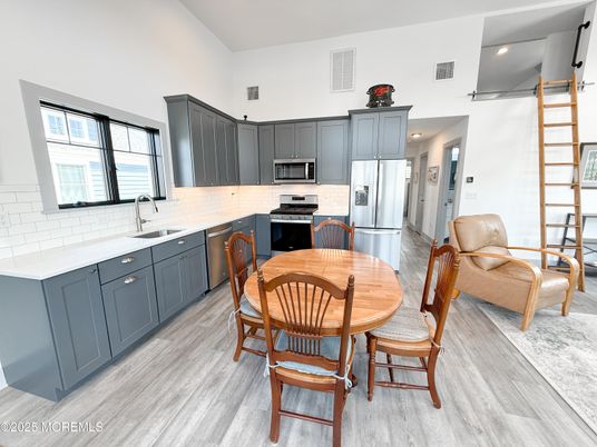 Dining room, Interior, Kitchen, Recessed Lighting, Stainless Steel Appliances, Wood Texture Flooring