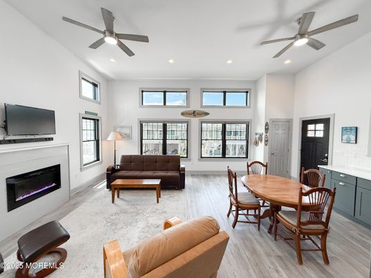 Dining room, Fireplace, Interior, Living room, Recessed Lighting, Wood Texture Flooring