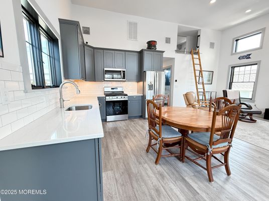 Dining room, Interior, Kitchen, Recessed Lighting, Stainless Steel Appliances, Wood Texture Flooring