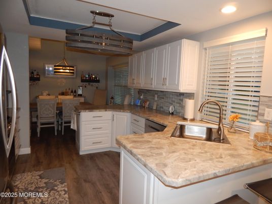 Dining room, Interior, Kitchen, Pendant Lights, Recessed Lighting, Stainless Steel Appliances, Wood Texture Flooring