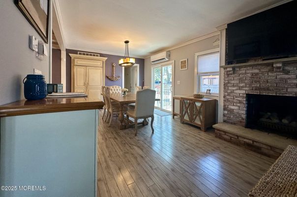 Dining room, Fireplace, Interior, Pendant Lights, Wood Texture Flooring