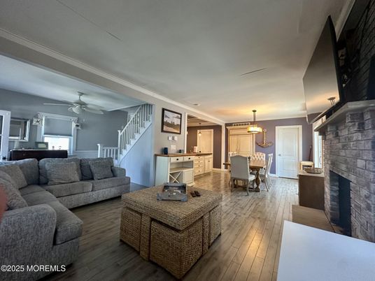 Dining room, Fireplace, Interior, Living room, Pendant Lights, Stone Walls, Wood Texture Flooring