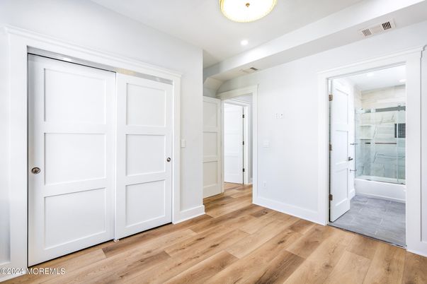 Bathroom, Empty room, Glass Shower, Interior, Recessed Lighting, Wood Texture Flooring