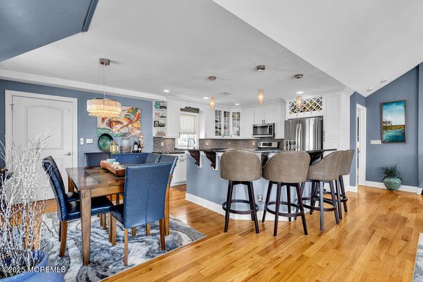 Dining room, Interior, Kitchen, Pendant Lights, Recessed Lighting, Stainless Steel Appliances, Wood Texture Flooring