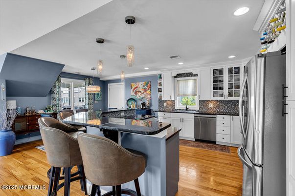 Dining room, Interior, Kitchen, Pendant Lights, Recessed Lighting, Stainless Steel Appliances, Wood Texture Flooring