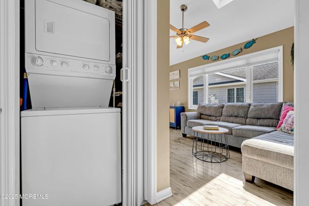 Interior, Living room, Utility Closets, Washer, Wood Texture Flooring