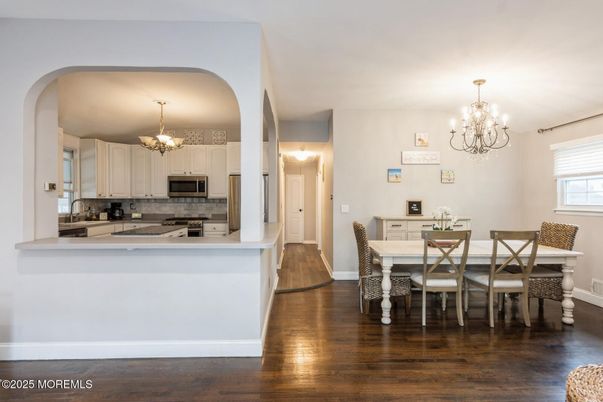 Chandelier, Dining room, Interior, Kitchen, Stainless Steel Appliances, Wood Texture Flooring
