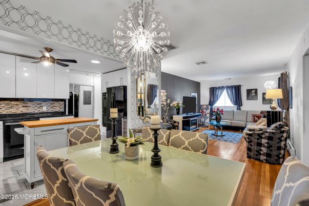 Chandelier, Dining room, Interior, Kitchen, Living room, Recessed Lighting, Stainless Steel Appliances, Wood Texture Flooring