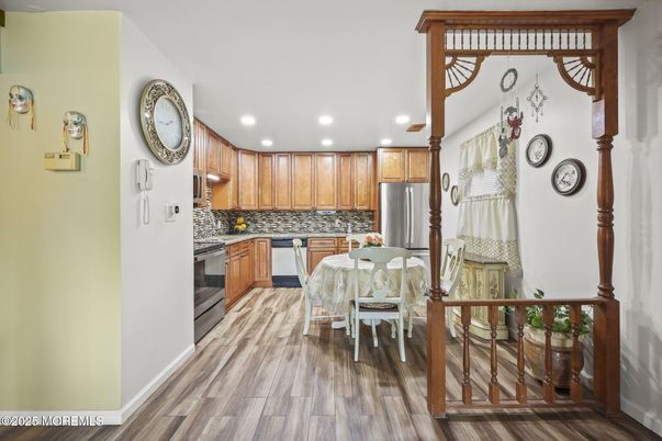 Dining room, Interior, Kitchen, Recessed Lighting, Stainless Steel Appliances, Wood Texture Flooring