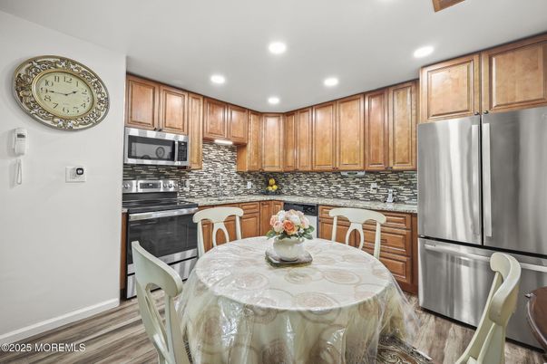 Dining room, Interior, Kitchen, Recessed Lighting, Stainless Steel Appliances, Wood Texture Flooring