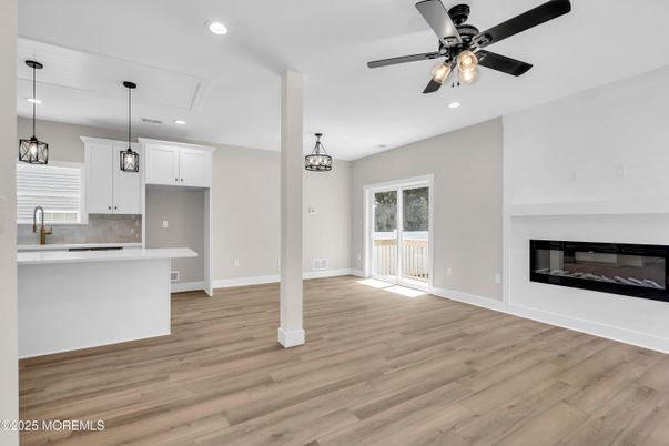 Empty room, Fireplace, Interior, Kitchen, Pendant Lights, Recessed Lighting, Wood Texture Flooring