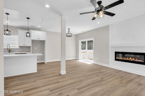 Empty room, Fireplace, Interior, Kitchen, Pendant Lights, Recessed Lighting, Wood Texture Flooring