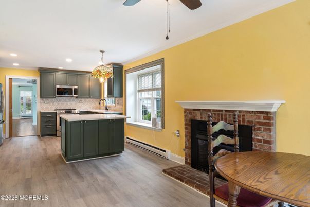 Fireplace, Interior, Kitchen, Recessed Lighting, Stainless Steel Appliances, Wood Texture Flooring