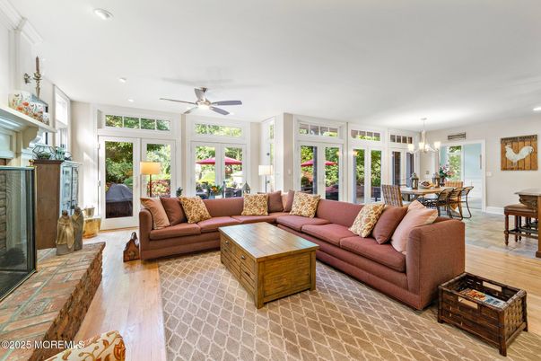 Chandelier, Dining room, Fireplace, Interior, Living room, Recessed Lighting, Wood Texture Flooring