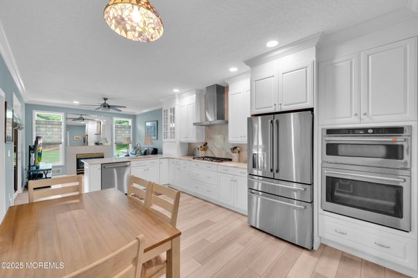 Dining room, Interior, Kitchen, Recessed Lighting, Stainless Steel Appliances, Wood Texture Flooring